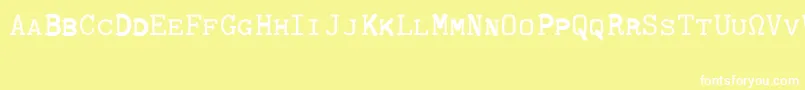 Czcionka CmTypewritercapsRegular – białe czcionki na żółtym tle