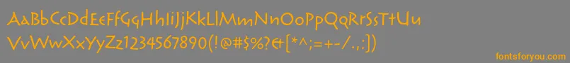 フォントReliqstdActive – オレンジの文字は灰色の背景にあります。