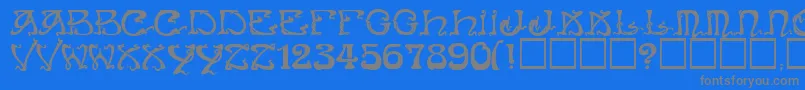 フォントArtNouveauCaps – 青い背景に灰色の文字