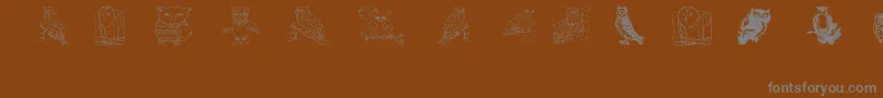 フォントAez Owls For Traci – 茶色の背景に灰色の文字