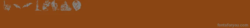 Czcionka HorrorDingbats – szare czcionki na brązowym tle