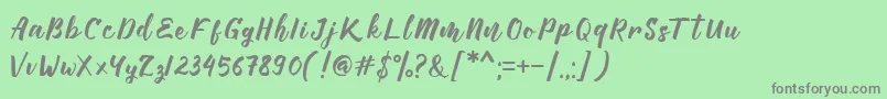 Manttes Font – Gray Fonts on Green Background