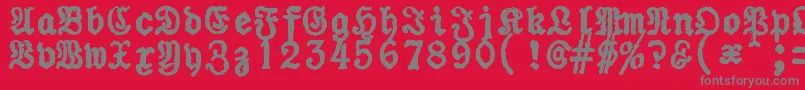 Fonte ZaiUraniapiccolatypewriter – fontes cinzas em um fundo vermelho