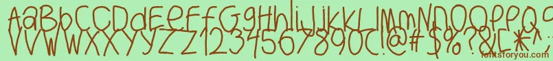フォントBigwriter – 緑の背景に茶色のフォント