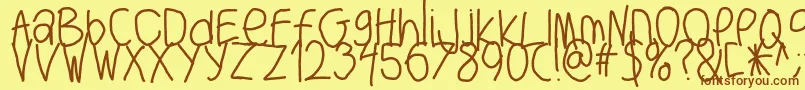 フォントBigwriter – 茶色の文字が黄色の背景にあります。