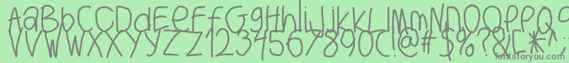 Bigwriter-fontti – harmaat kirjasimet vihreällä taustalla