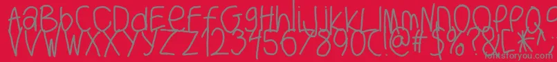 Bigwriter-fontti – harmaat kirjasimet punaisella taustalla