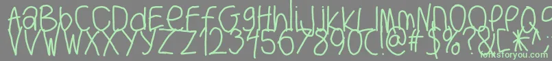 フォントBigwriter – 灰色の背景に緑のフォント