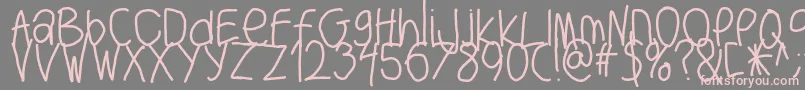 フォントBigwriter – 灰色の背景にピンクのフォント