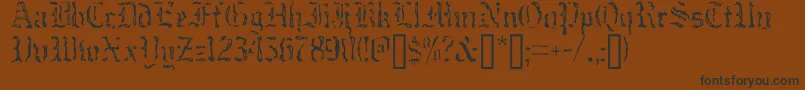 フォントCausticMonkNormal – 黒い文字が茶色の背景にあります