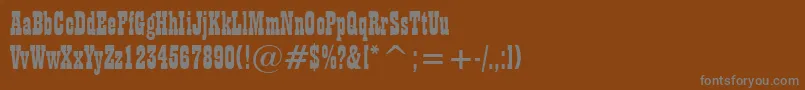 PlaybillBt-fontti – harmaat kirjasimet ruskealla taustalla