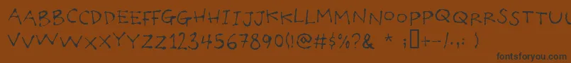 Poilet Font – Black Fonts on Brown Background