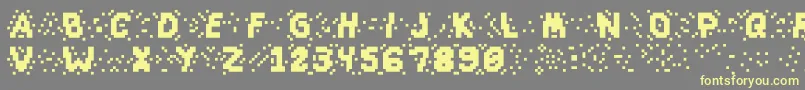 Slapandcrumblyal-Schriftart – Gelbe Schriften auf grauem Hintergrund