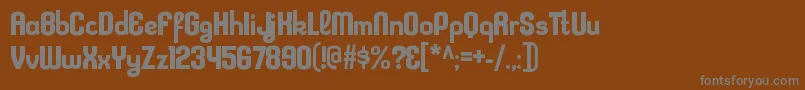 KleptocracyrgBold-fontti – harmaat kirjasimet ruskealla taustalla