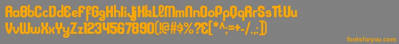 フォントKleptocracyrgBold – オレンジの文字は灰色の背景にあります。