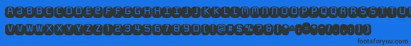 Monofett Font – Black Fonts on Blue Background