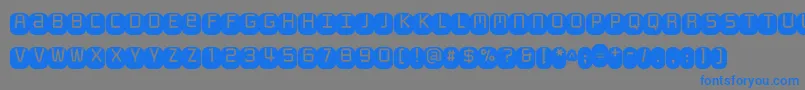 Monofett Font – Blue Fonts on Gray Background