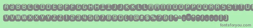 Monofett Font – Gray Fonts on Green Background