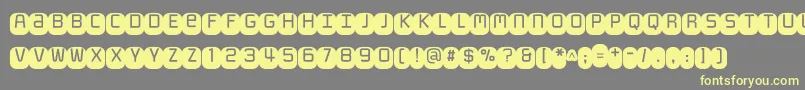 Monofett Font – Yellow Fonts on Gray Background