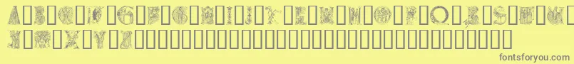 Medievalalphabet-fontti – harmaat kirjasimet keltaisella taustalla