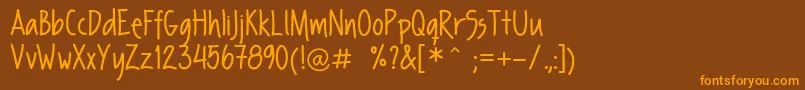 フォントFpSecondHand – オレンジ色の文字が茶色の背景にあります。