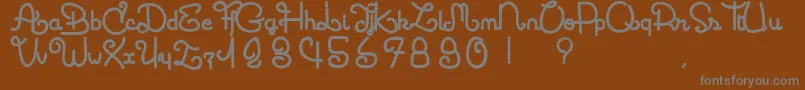 フォントCoccinelle – 茶色の背景に灰色の文字