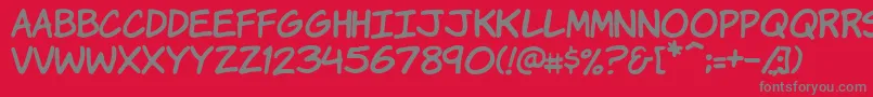 フォントVtckomixationhand – 赤い背景に灰色の文字