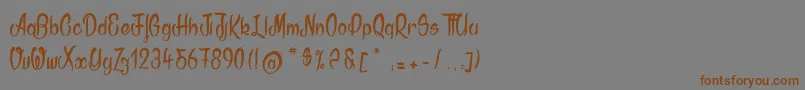 フォントAkodia – 茶色の文字が灰色の背景にあります。