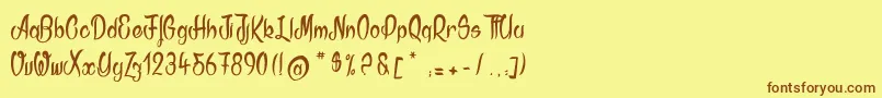 フォントAkodia – 茶色の文字が黄色の背景にあります。