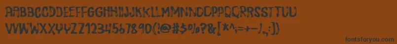 フォントDispositionDemo – 黒い文字が茶色の背景にあります