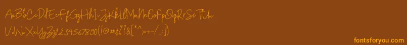 Czcionka Gunungpring – pomarańczowe czcionki na brązowym tle