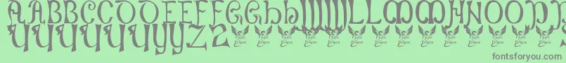フォントBattelabbey – 緑の背景に灰色の文字