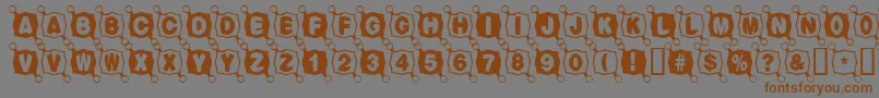 Balltack-Schriftart – Braune Schriften auf grauem Hintergrund