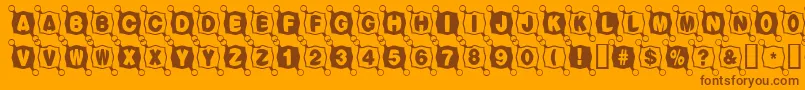 Balltack-Schriftart – Braune Schriften auf orangefarbenem Hintergrund