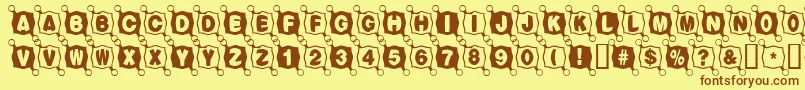 Fonte Balltack – fontes marrons em um fundo amarelo
