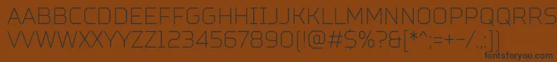 TtSquaresCondensedThinDemo Font – Black Fonts on Brown Background