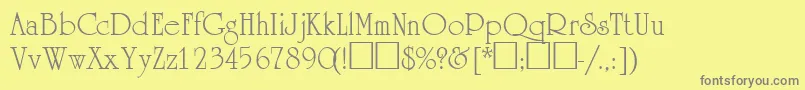 AcademiasskRegular-fontti – harmaat kirjasimet keltaisella taustalla