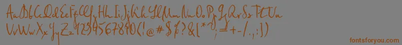 フォントFederico – 茶色の文字が灰色の背景にあります。