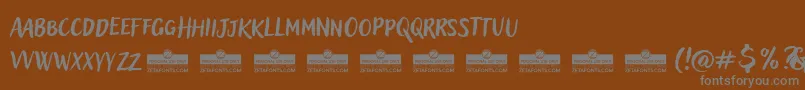 Шрифт AdleryProBlockletterTrial – серые шрифты на коричневом фоне