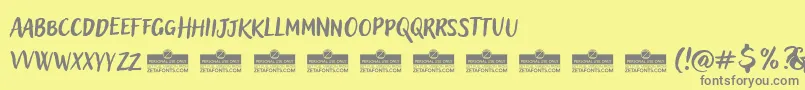 Fonte AdleryProBlockletterTrial – fontes cinzas em um fundo amarelo