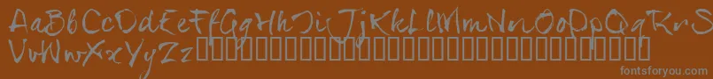 SerialsT-fontti – harmaat kirjasimet ruskealla taustalla
