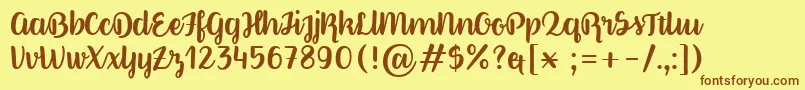 Fonte BetterPhoenixSample – fontes marrons em um fundo amarelo