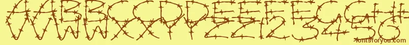 フォントBarbedWires – 茶色の文字が黄色の背景にあります。