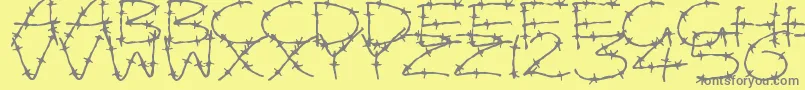 フォントBarbedWires – 黄色の背景に灰色の文字