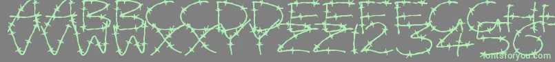 Шрифт BarbedWires – зелёные шрифты на сером фоне
