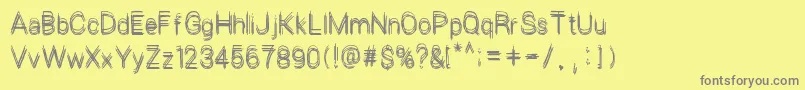 LePetitChaos Font – Gray Fonts on Yellow Background