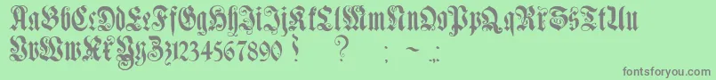 GenzschEtHeyseAlternate-Schriftart – Graue Schriften auf grünem Hintergrund