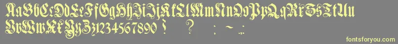 GenzschEtHeyseAlternate-Schriftart – Gelbe Schriften auf grauem Hintergrund