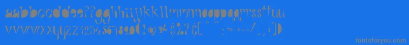 フォントAlphabitsFat – 青い背景に灰色の文字