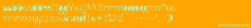 AlphabitsFat-Schriftart – Grüne Schriften auf orangefarbenem Hintergrund